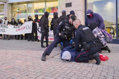Protester faces charges after conference building damaged in London, Ont.: police