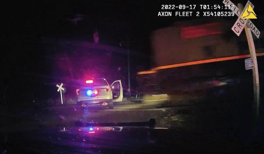 Colorado cop on trial for putting suspect in car hit by train says she didn't know engine was coming
