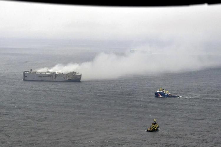 Salvage crews wait for chance to board a freighter burning for 2 days off the Dutch coast