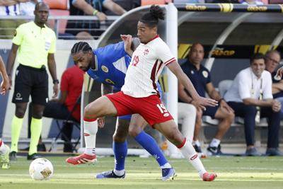 Stoppage-time goal lifts Curaçao into a 1-1 draw with Canada at Gold Cup