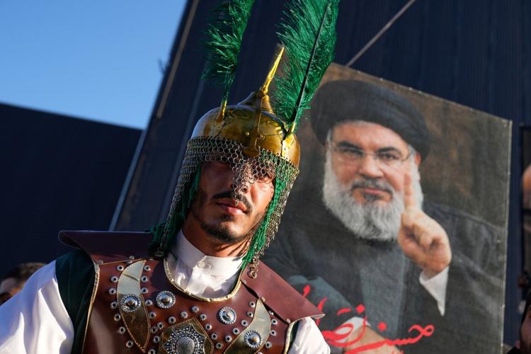 Photos show Ashoura commemorations shaped by war and loss in Lebanon and Iran