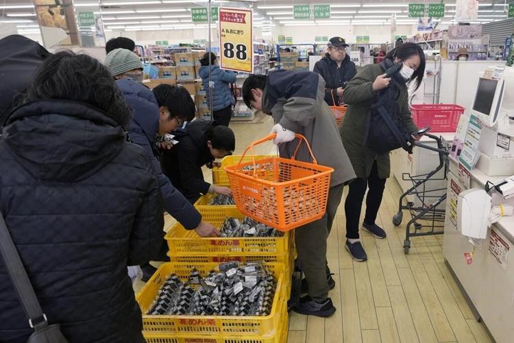Death toll from western Japan earthquakes rises to 126 as rain and snow imperil already shaky ground