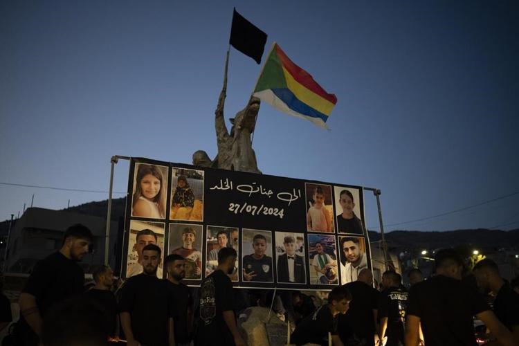 Israel weighs response to Hezbollah after a rocket from Lebanon kills 12 youths on a soccer field