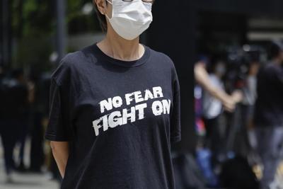 Hong Kong court sentences journalist to 21 months in jail in case seen as barometer of press freedom