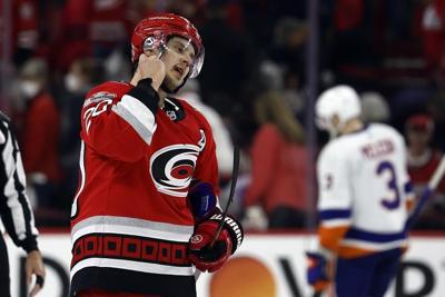 Canes' Aho, Oilers' Hyman each take a puck off the face
