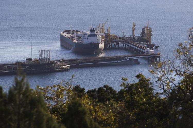 Russia says it will cut oil production over Western caps