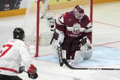 US upsets defending champ Finland, Canada routs Latvia to open ice hockey worlds
