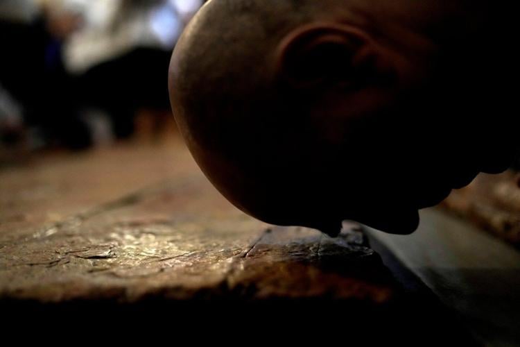 An AP reporter spends the night locked inside Jerusalem's holiest church with clergy and pilgrims