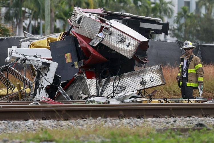 Train collides with fire truck in Florida. Police say 3 firefighters and at least 12 passengers hurt