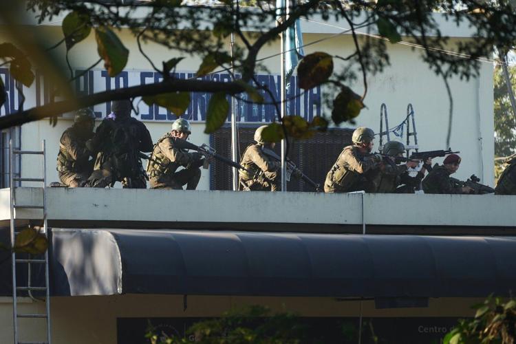 Guatemalan police free hostages in prison as attacks kill 3 officers