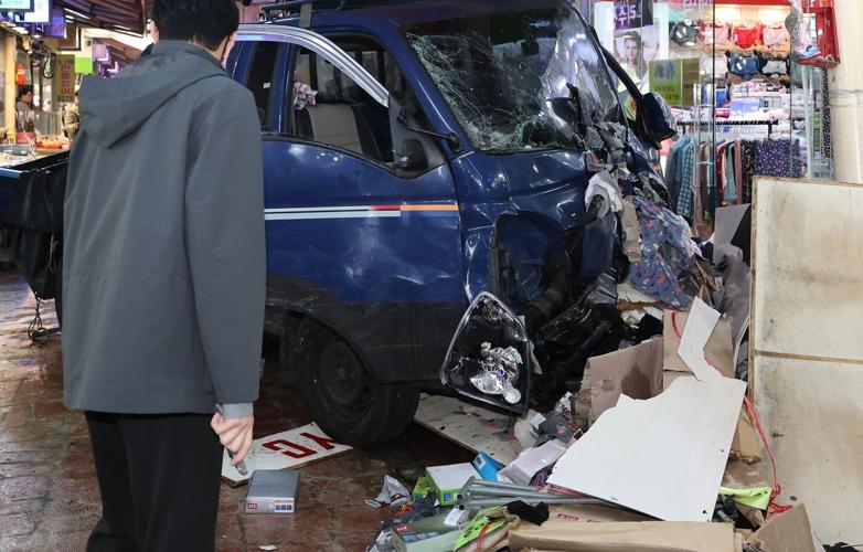 Truck crash in South Korea market kills 2 people and injures 18, officials say