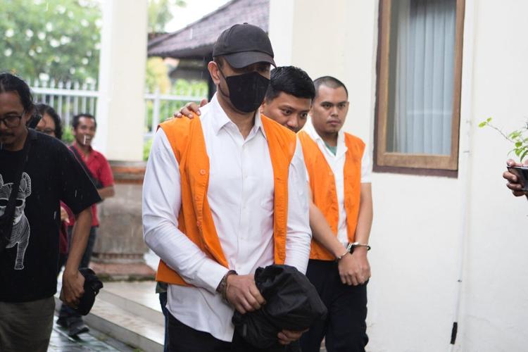 Indonesian court sentences an Australian to 12 years in prison for smuggling cocaine to Bali