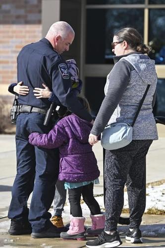 A shaken Minnesota community gets some answers on the killings of 2 officers and 1 firefighter