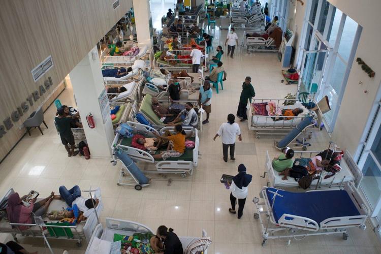Rescuers dig through rubble and landslides after Indonesia quake kills 47