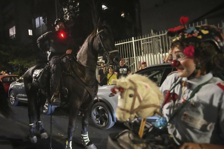 Photos of Israelis demanding the release of hostages and an end to the war with Hamas