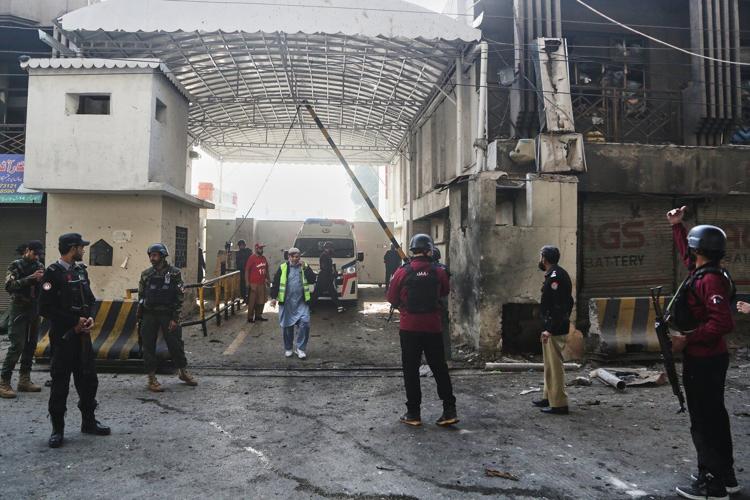 Suicide bombers strike security force headquarters in northwestern Pakistan, killing 3 officers