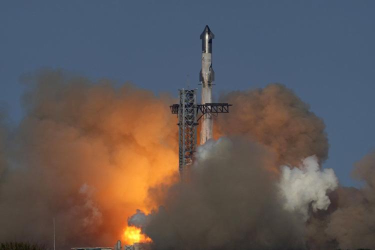 SpaceX launches giant Starship rocket, but aborts attempt to catch booster with mechanical arms