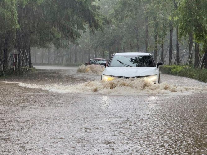 Heavy rain falls in parts of Southeast Asia after tropical storm blows into Vietnam