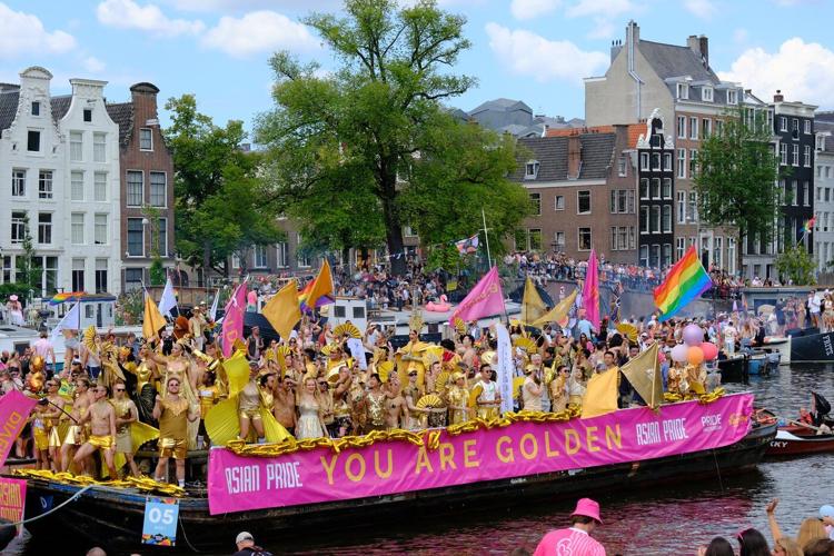 Hundreds of thousands line Amsterdam canals for the annual Pride boat parade