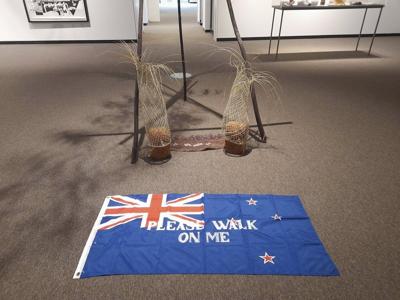 A controversial flag invited art gallery visitors to 'please walk on me.' It lasted 19 days