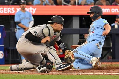 Old school baseball carries Blue Jays past Yankees and to the top of the AL East