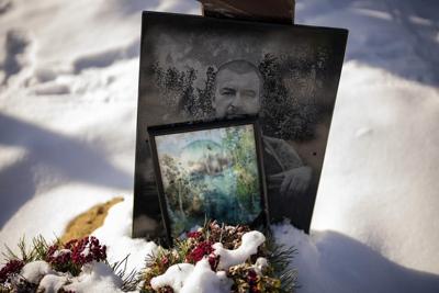 AP PHOTOS: Fading graveside portraits of Ukraine's war dead