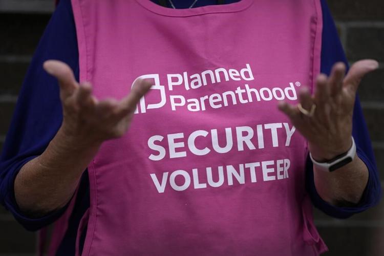 After years of fighting Iowa's strict abortion law, clinics also prepared to follow it