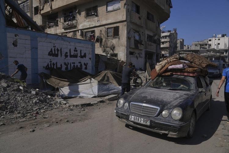 The Latest: Israel says bodies of 2 hostages returned as military begins Gaza City offensive