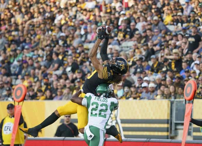 Johnson's late TD lifts unbeaten Roughriders to 28-23 win over Tiger-Cats
