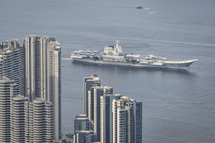 Chinese aircraft carrier sails into Hong Kong to boost patriotism