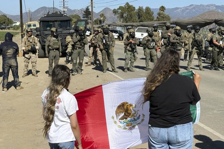 Protesters and federal agents clash during raid at Southern California farm