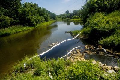 Company official charged in 2022 oil-chemical discharge into Michigan's Flint River