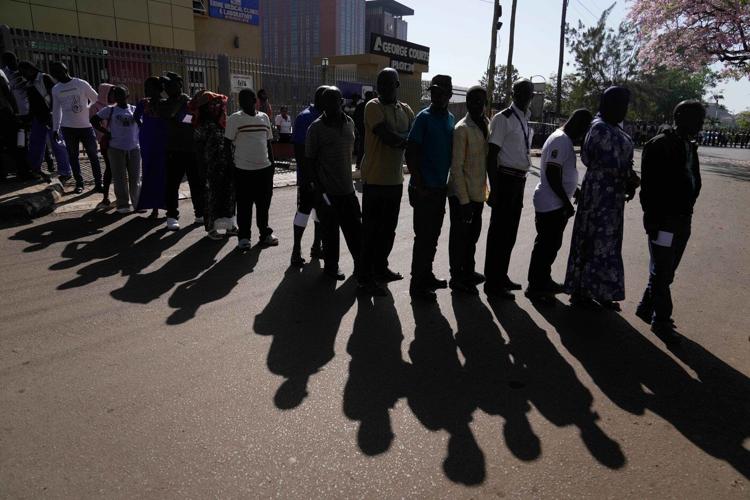 Photos show voters going to the polls in Uganda's presidential election