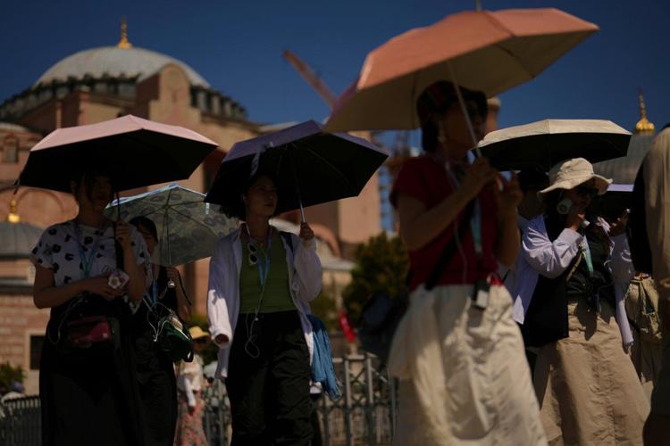 Scientists call another near-record hot year a 'warning shot' of a shifting, dangerous climate