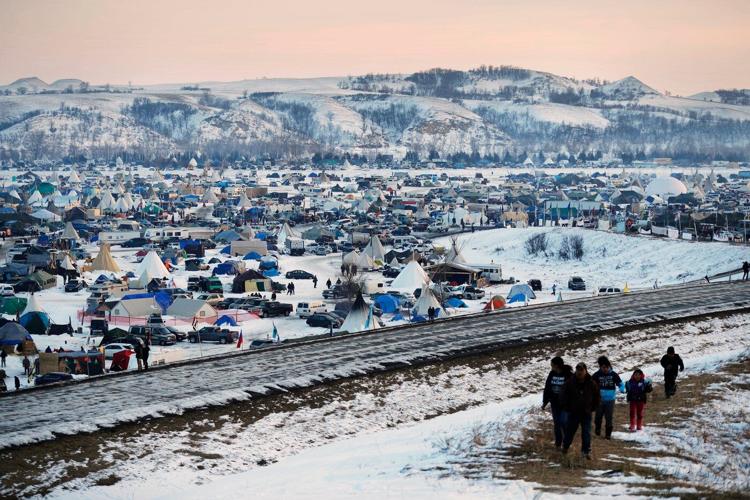 Years after oil pipeline protests, North Dakota and the federal government settle policing lawsuit