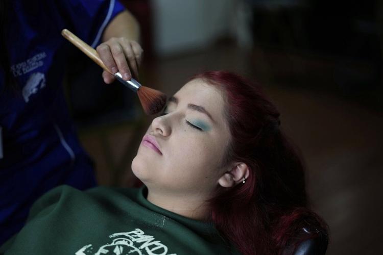AP PHOTOS: Colombian quinceañeras see dream come true with the support of many, including the police