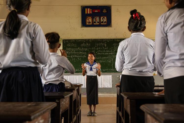 Photos show Cambodian children attend school in floating villages along the Tonle Sap lake.