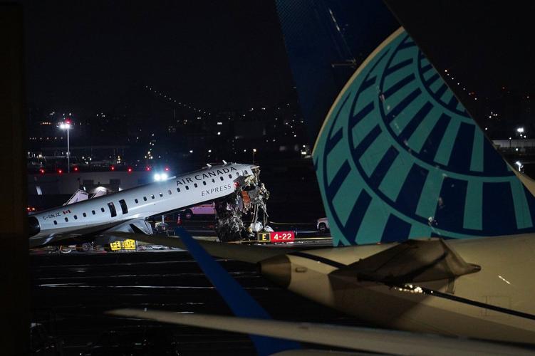 Photos show the scene of a collision on a runway at LaGuardia Airport in New York