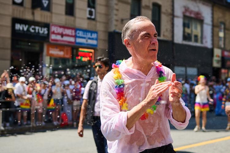 Revellers drench Mark Carney with water as Toronto celebrates Pride Parade