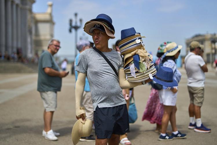 Europe sizzles and the Eiffel Tower's summit closes