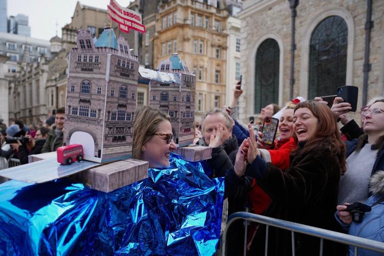 Photos of Londoners in costume sprinting with frying pans on Pancake Day