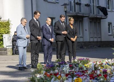 German leader vows tougher knife laws and more deportations after fatal attack in Solingen