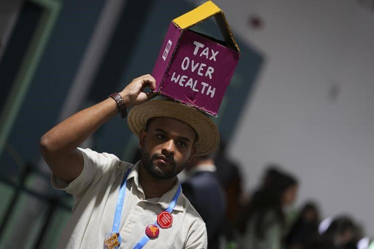 Protesters' biggest day expected at UN climate talks, where progress is slow