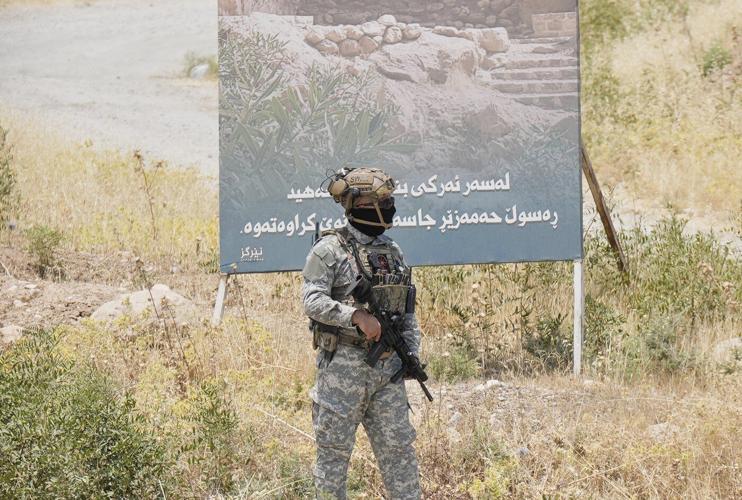 Kurdish separatist fighters in Iraq begin laying down weapons as part of peace process with Turkey