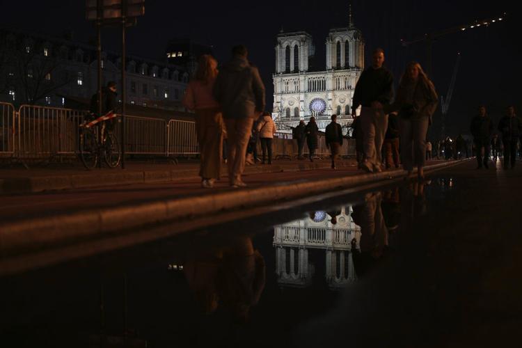 The Latest: The famed Notre Dame Cathedral in Paris reopens to great fanfare