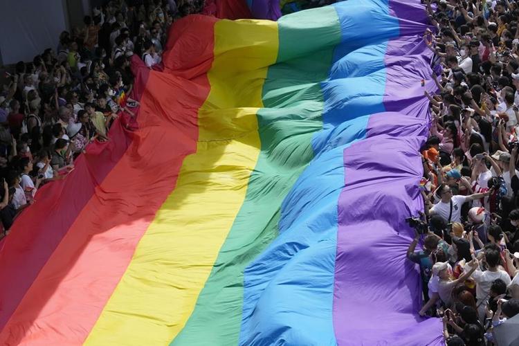Lawmakers in Thailand overwhelmingly approve a bill to legalize same-sex marriage