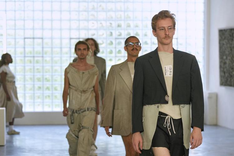 Simon Cracker creates a brand uniform to highlight star upcycled garments during Milan Fashion Week