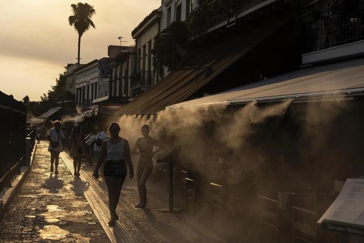 As the summer breezes fade, sweltering Europeans give air conditioning a skeptical embrace