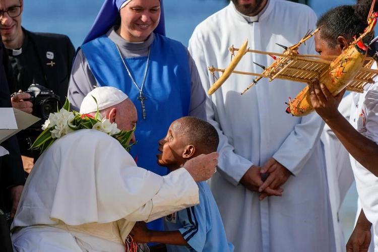 Pope arrives in the remote jungles of Papua New Guinea with a ton of humanitarian aid and toys