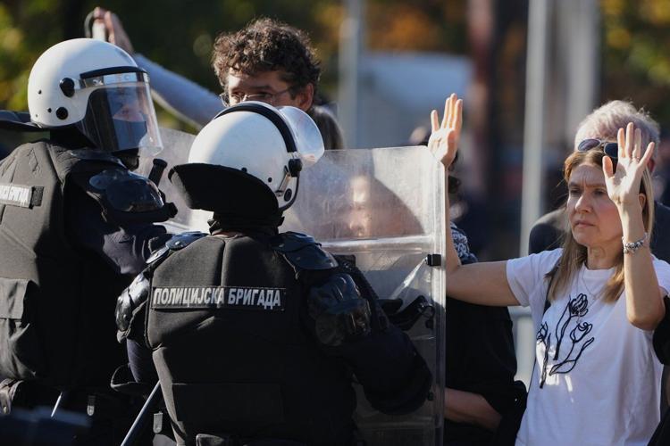 Riot police separate opponents, loyalists of Serbia's president as tensions soar amid protests